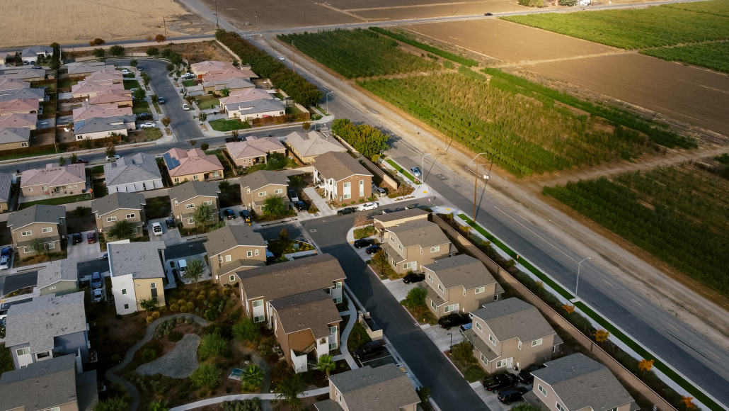 Aerial view of Rosaleda Village and almond tree crops in Wasco, California